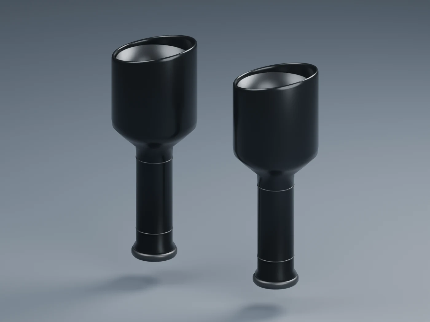 Pair of black exhaust tips with surface and interior detail